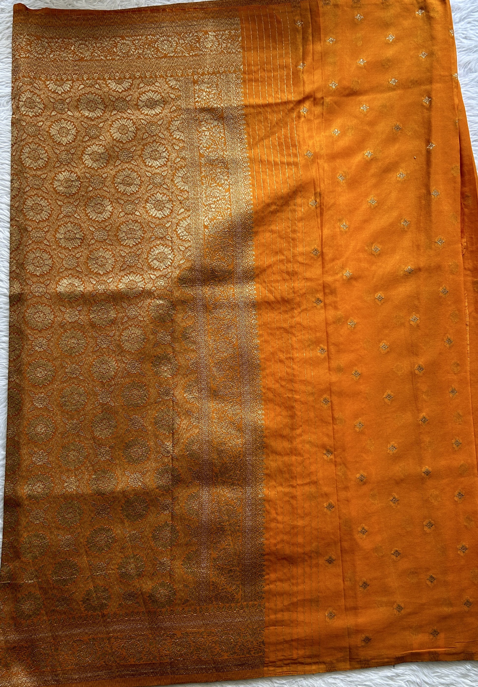 Semi Georgette Saree Orange Colored Complemented with a Zari Border. - Sampradaya Designer Studio