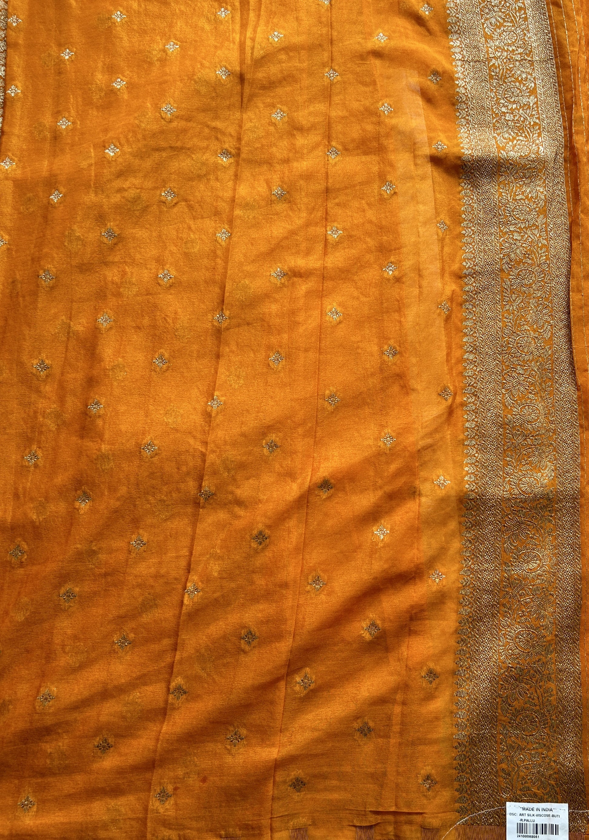 Semi Georgette Saree Orange Colored Complemented with a Zari Border. - Sampradaya Designer Studio