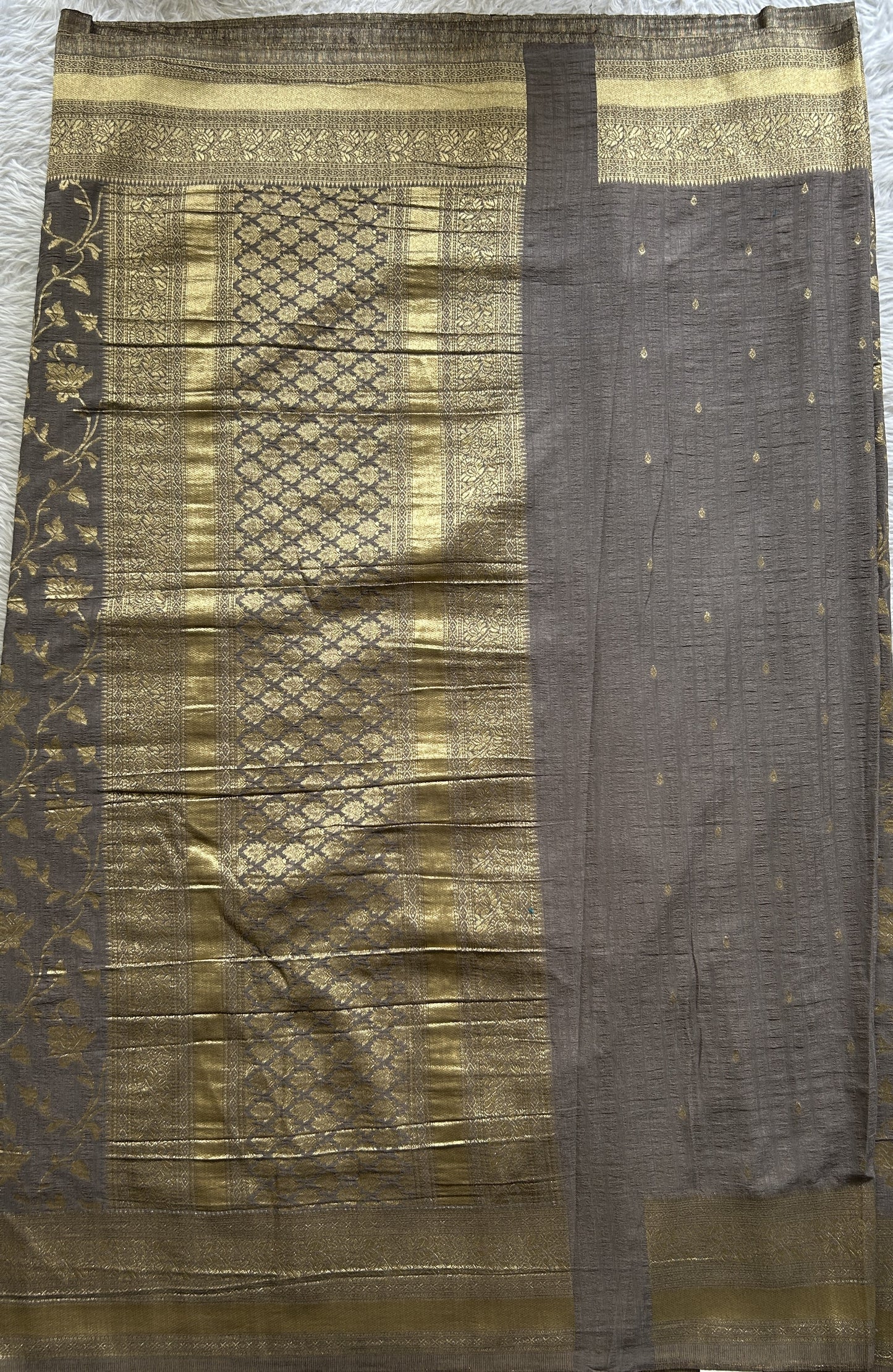 Semi Georgette Saree Ash Colored Complemented with a Zari Border. - Sampradaya Designer Studio