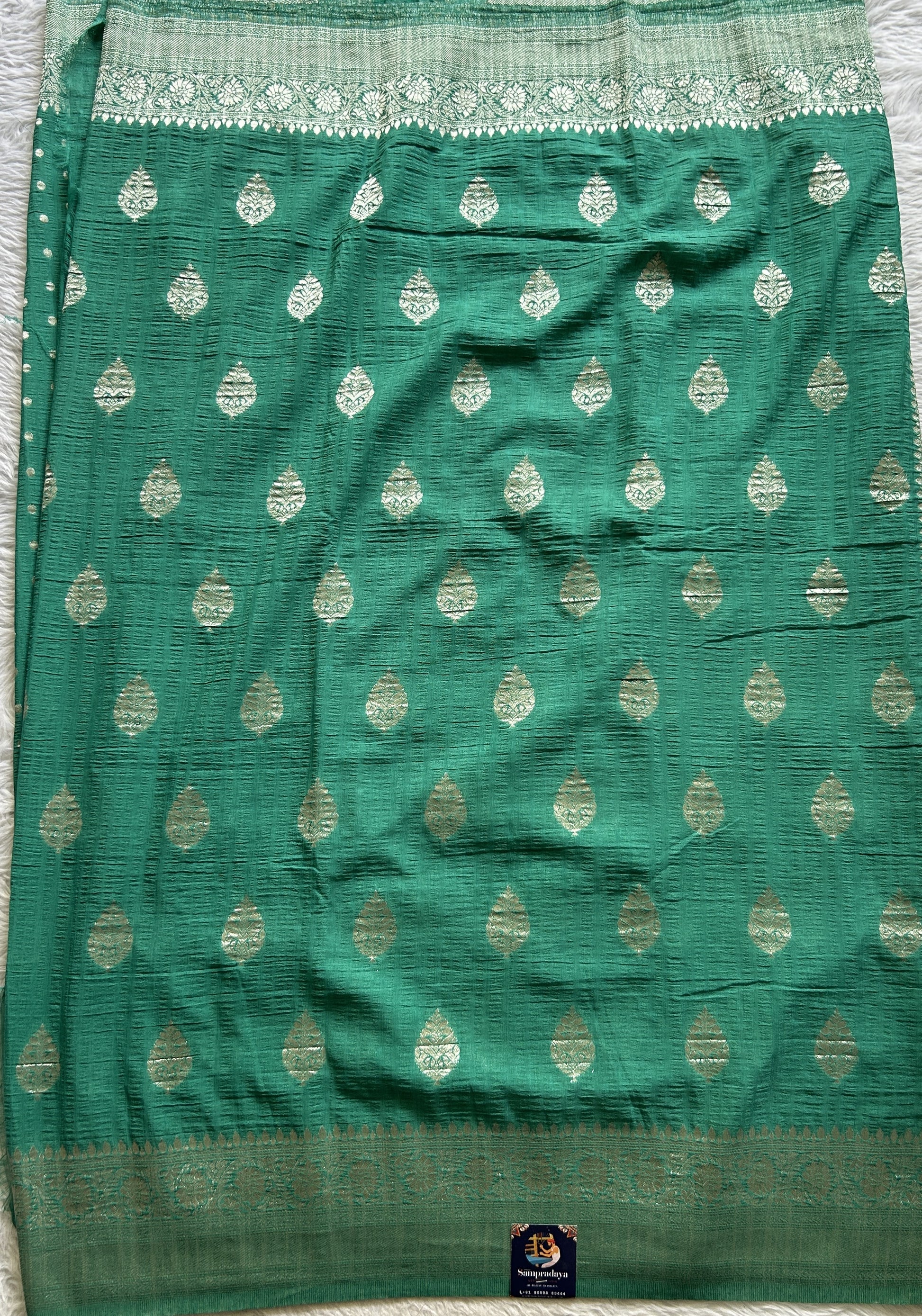 Semi Georgette Saree Aqua Green Colored Complemented with a Zari Border. - Sampradaya Designer Studio