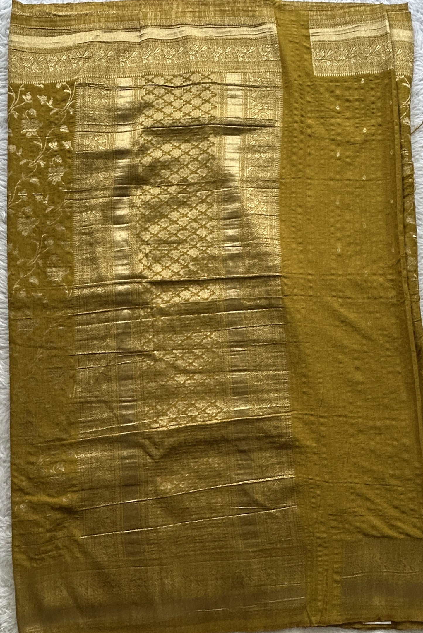 Semi Georgette Saree Olive Green Colored Complemented with a Zari Border. - Sampradaya Designer Studio