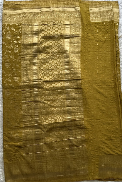 Semi Georgette Saree Olive Green Colored Complemented with a Zari Border. - Sampradaya Designer Studio