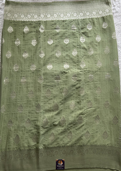 Semi Georgette Saree Pista Green Colored Complemented with a Zari Border. - Sampradaya Designer Studio