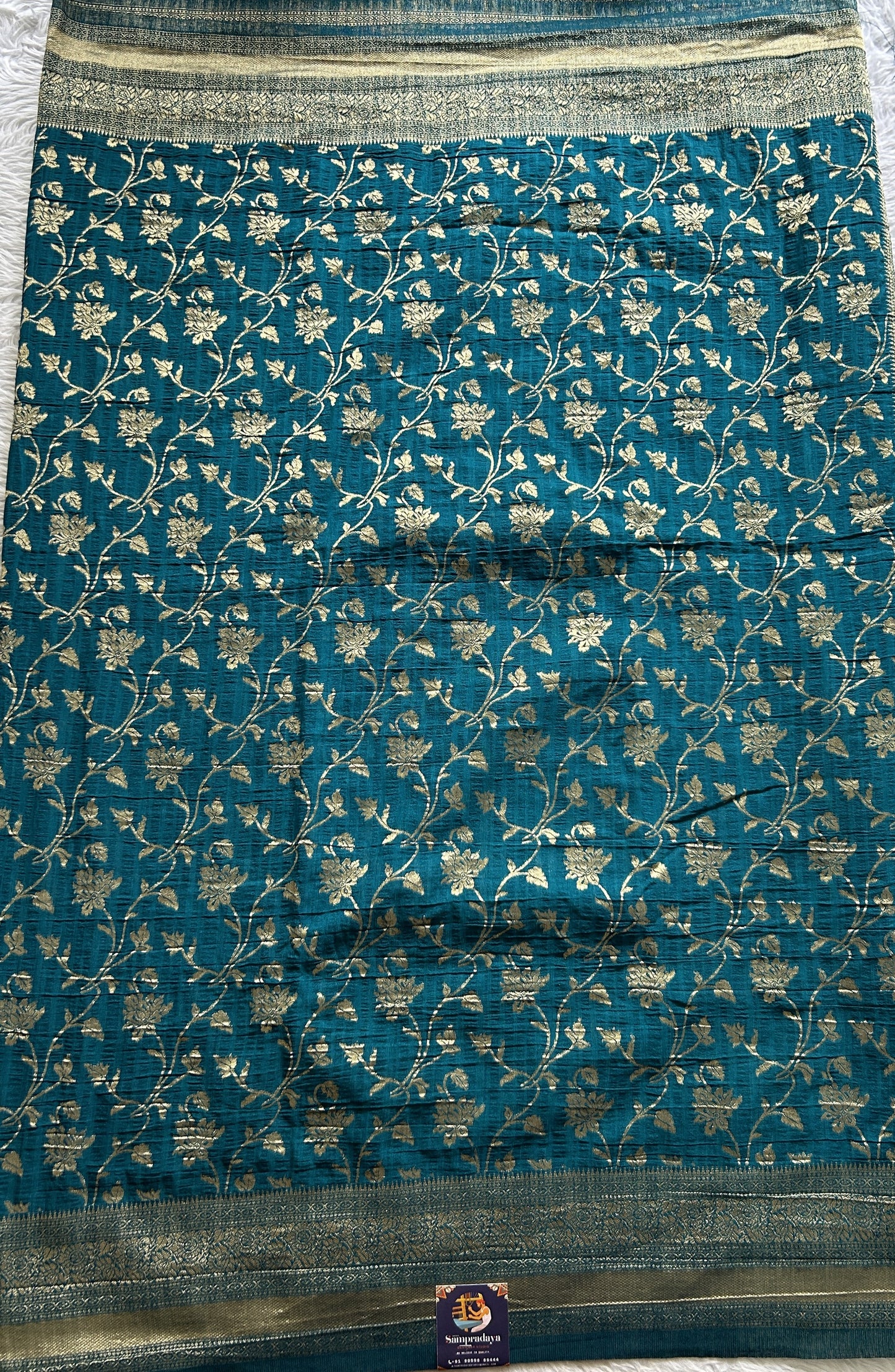 Semi Georgette Saree Turquoise Blue Colored Complemented with a Zari Border. - Sampradaya Designer Studio