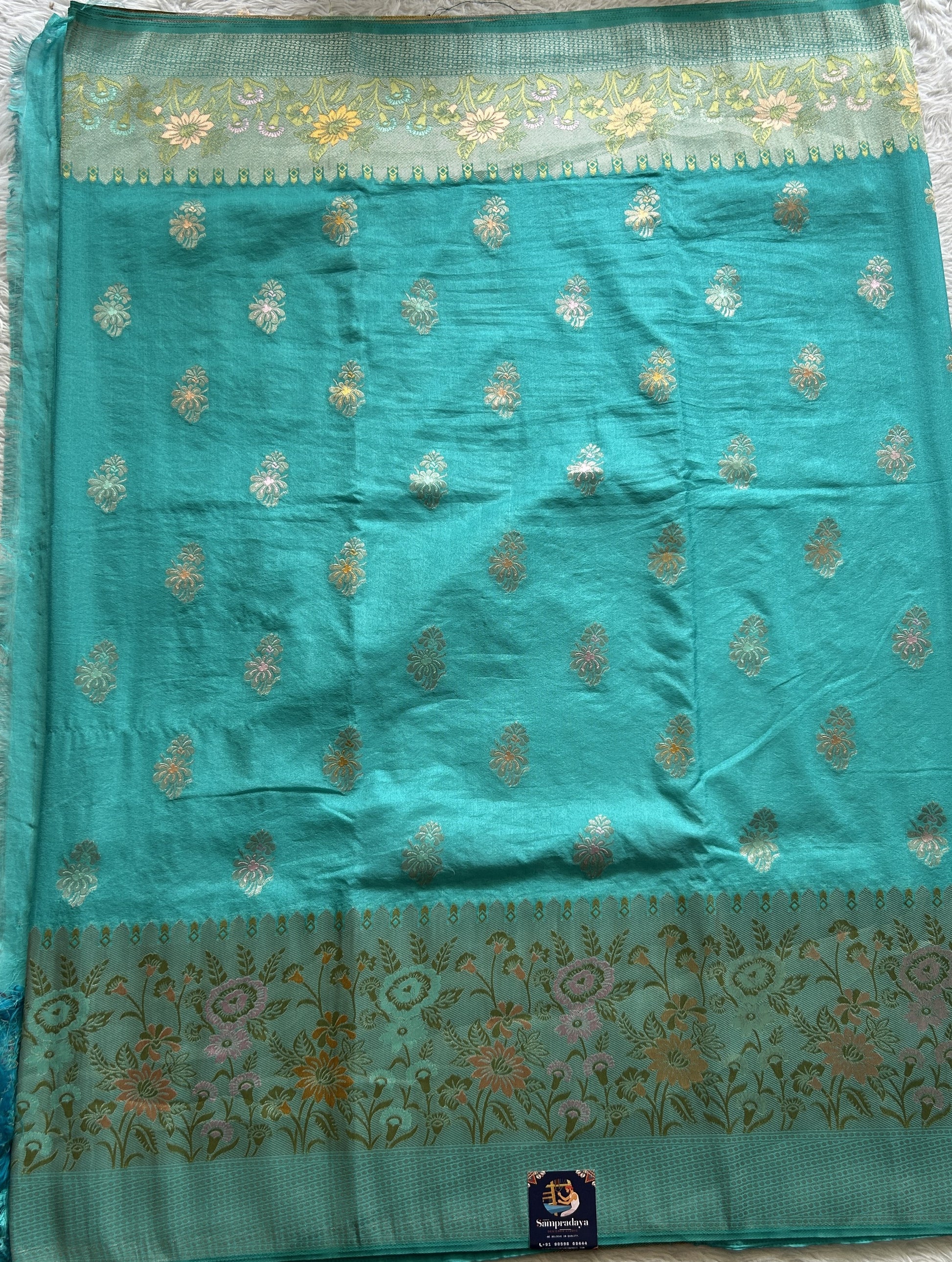 Semi Georgette Saree Sky Blue Colored Complemented with a Zari Border. - Sampradaya Designer Studio