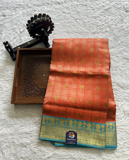 Venkatagiri Pattu Saree Orange Colored Complemented With a Blue Color Zari Border - Sampradaya Designer Studio