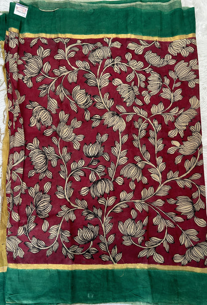 Pen Kalamkari Saree Maroon colored allover saree complemented with a Dark Green Colored Plain border - Sampradaya Designer Studio