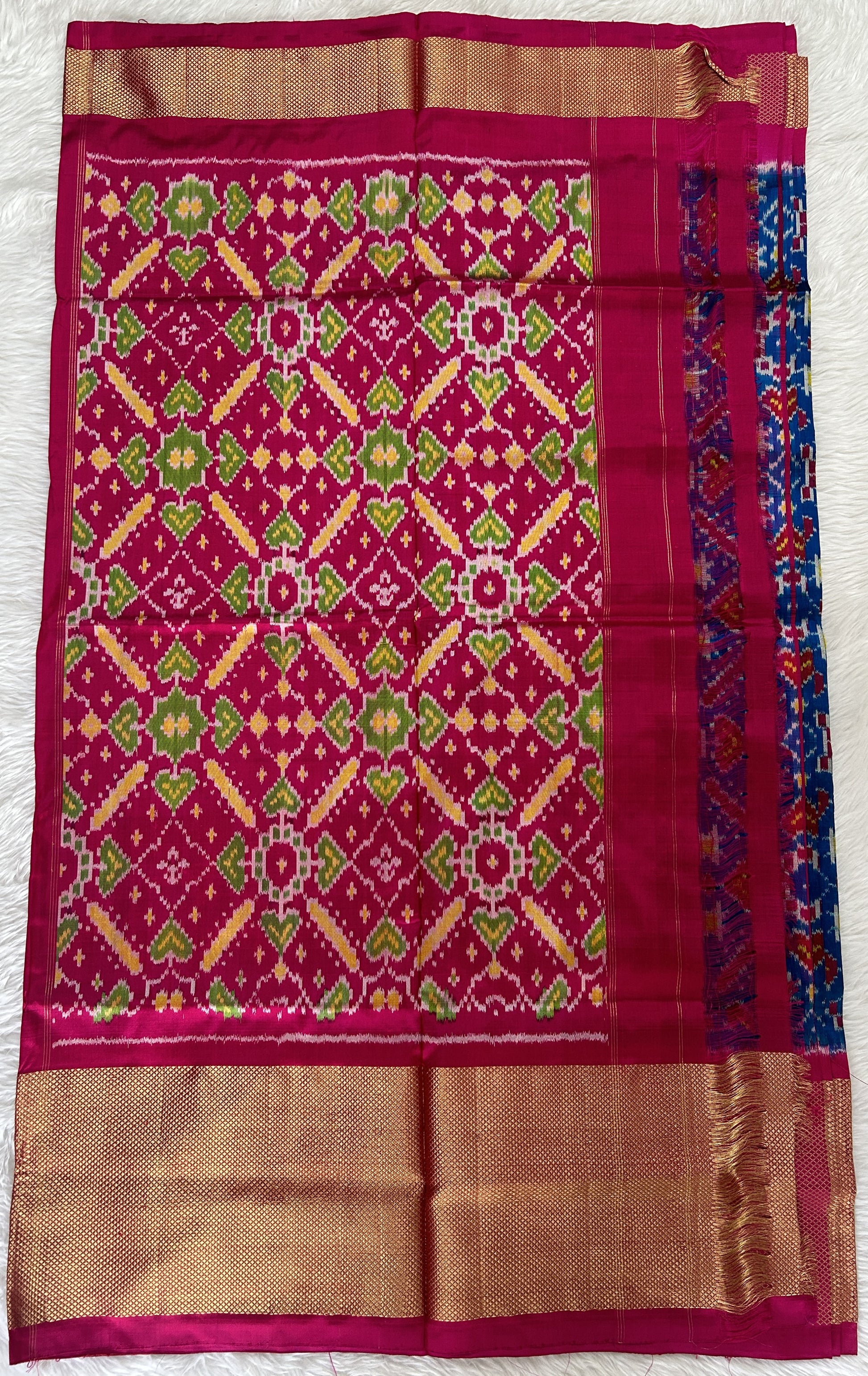 Ikkat Pattu Saree Blue colored Saree complemented with a Pink Colored Gold Kanchi border. - Sampradaya Designer Studio