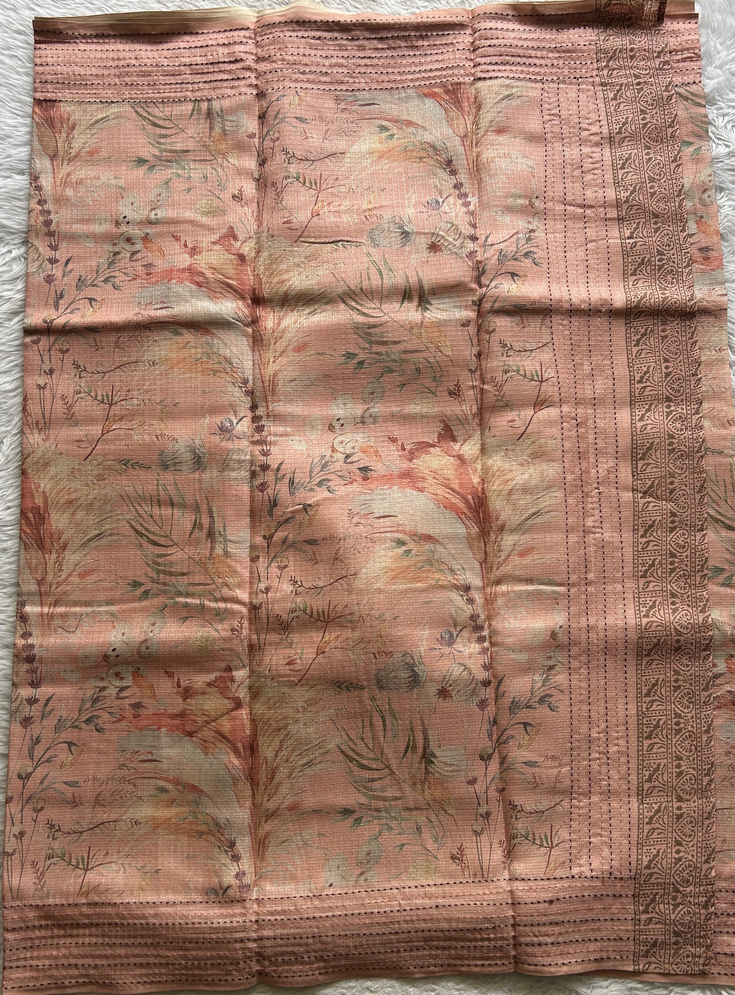 Semi Tussar Saree Peach Colored complemented with a Running Stich Border. - Sampradaya Designer Studio