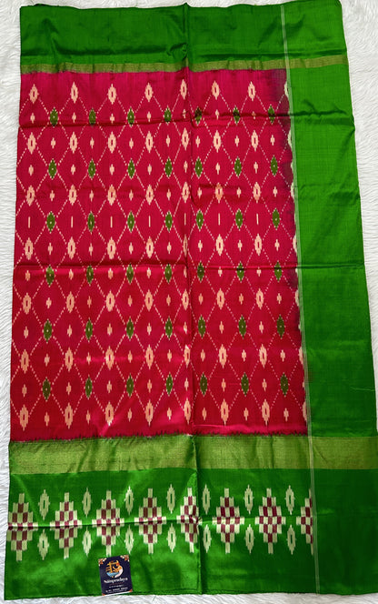 Ikkat Pattu Saree Pink colored Saree complemented with a Green Colored Ikkat border. - Sampradaya Designer Studio