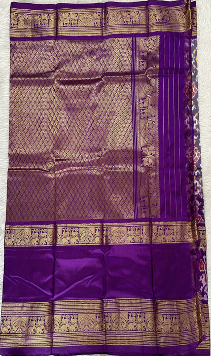 Ikkat Pattu Saree Blue colored Saree complemented with a Purple Colored Kanchi border. - Sampradaya Designer Studio