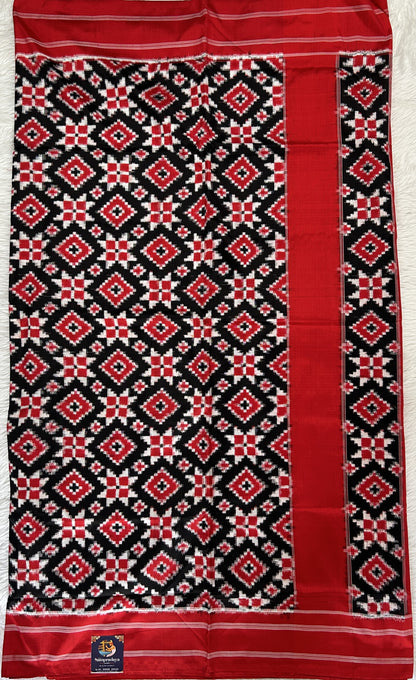 Ikkat Pattu Saree Black colored Saree complemented with a Red Colored Plain border. - Sampradaya Designer Studio