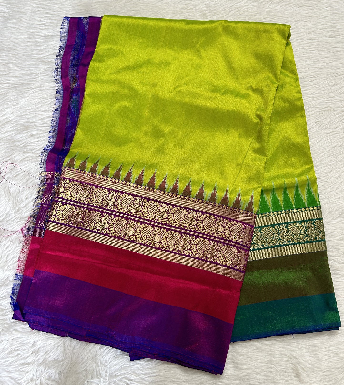 Ikkat Pattu Saree Light Green colored Saree complemented with a Purple and Green Colored Kanchi border. - Sampradaya Designer Studio