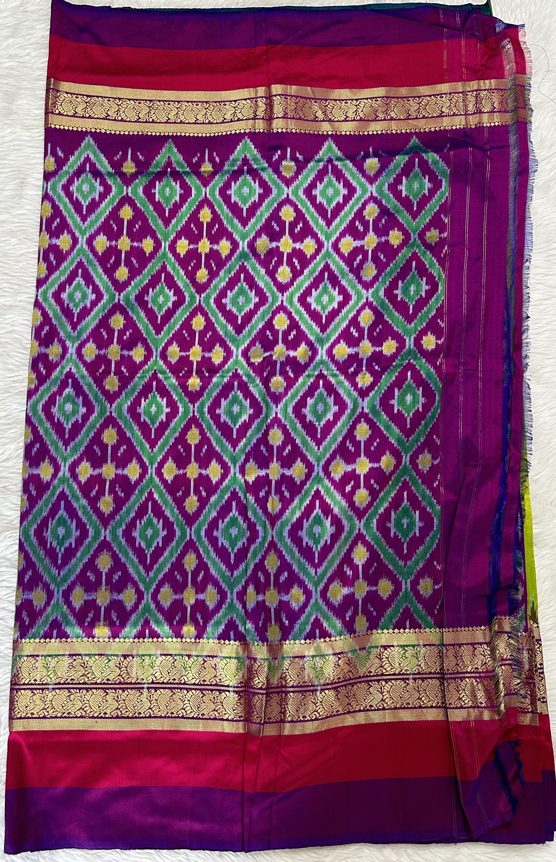 Ikkat Pattu Saree Light Green colored Saree complemented with a Purple and Green Colored Kanchi border. - Sampradaya Designer Studio