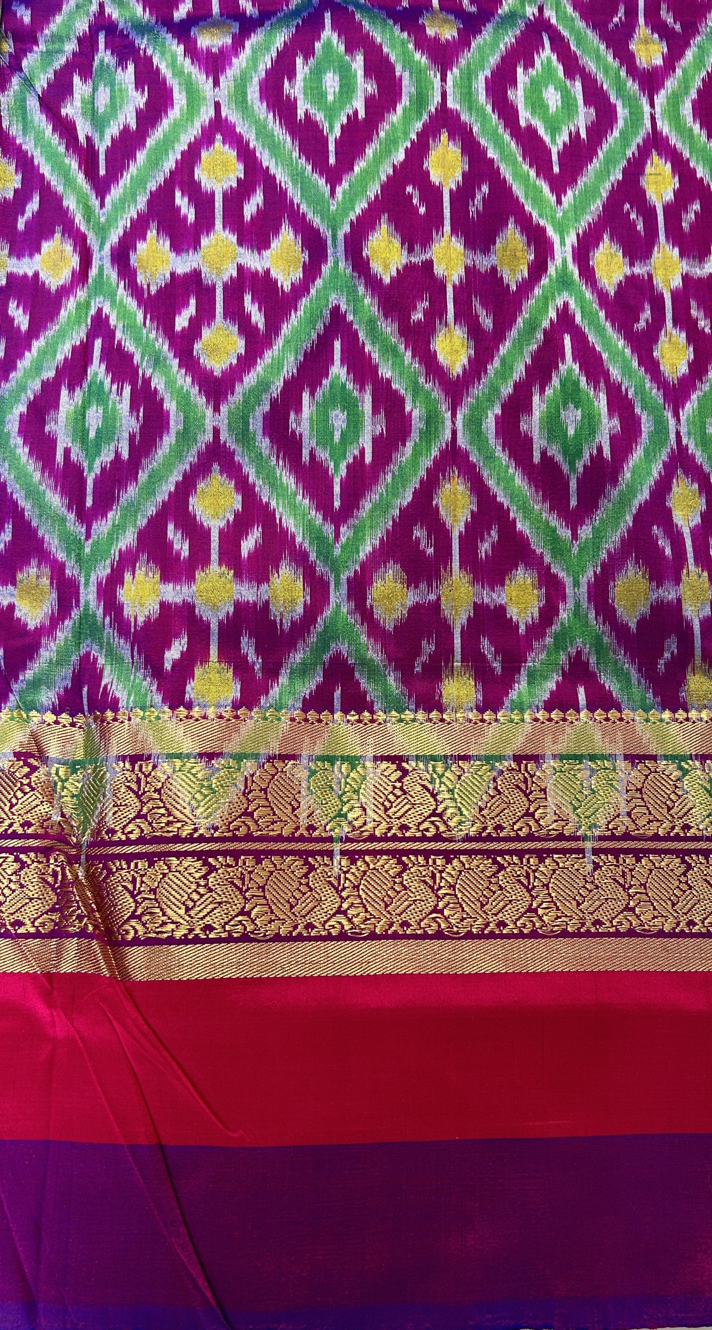 Ikkat Pattu Saree Light Green colored Saree complemented with a Purple and Green Colored Kanchi border. - Sampradaya Designer Studio