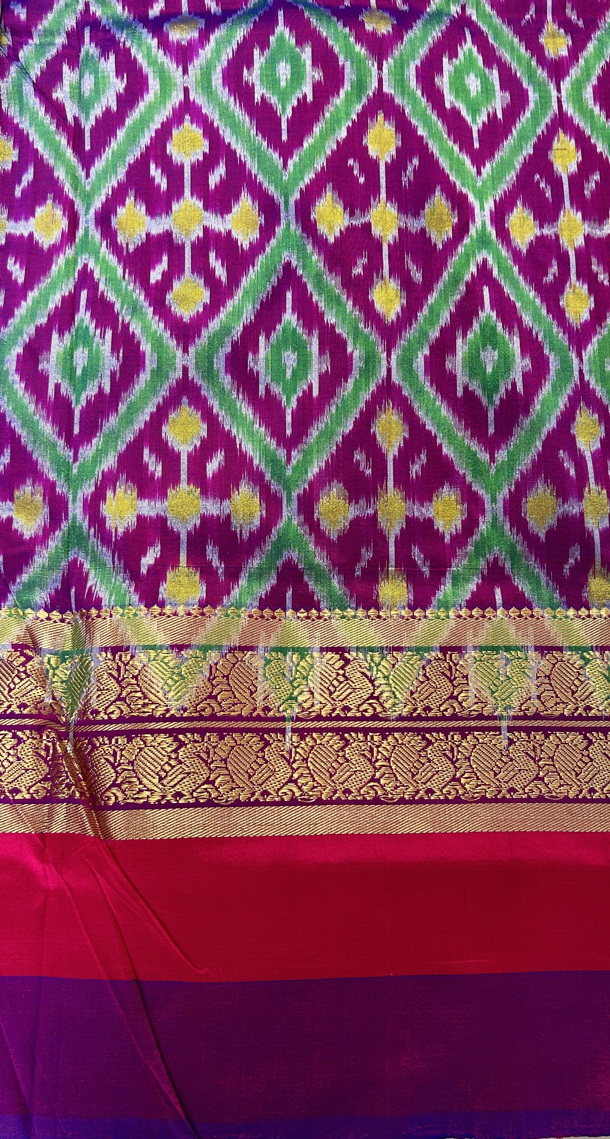 Ikkat Pattu Saree Light Green colored Saree complemented with a Purple and Green Colored Kanchi border. - Sampradaya Designer Studio