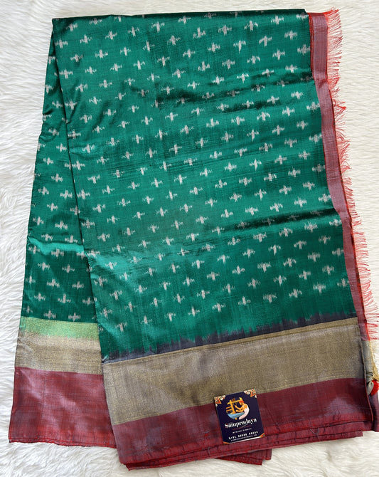 Ikkat Pattu Saree Bottle Green colored Saree complemented with a Onion Pink Colored Plain border. - Sampradaya Designer Studio