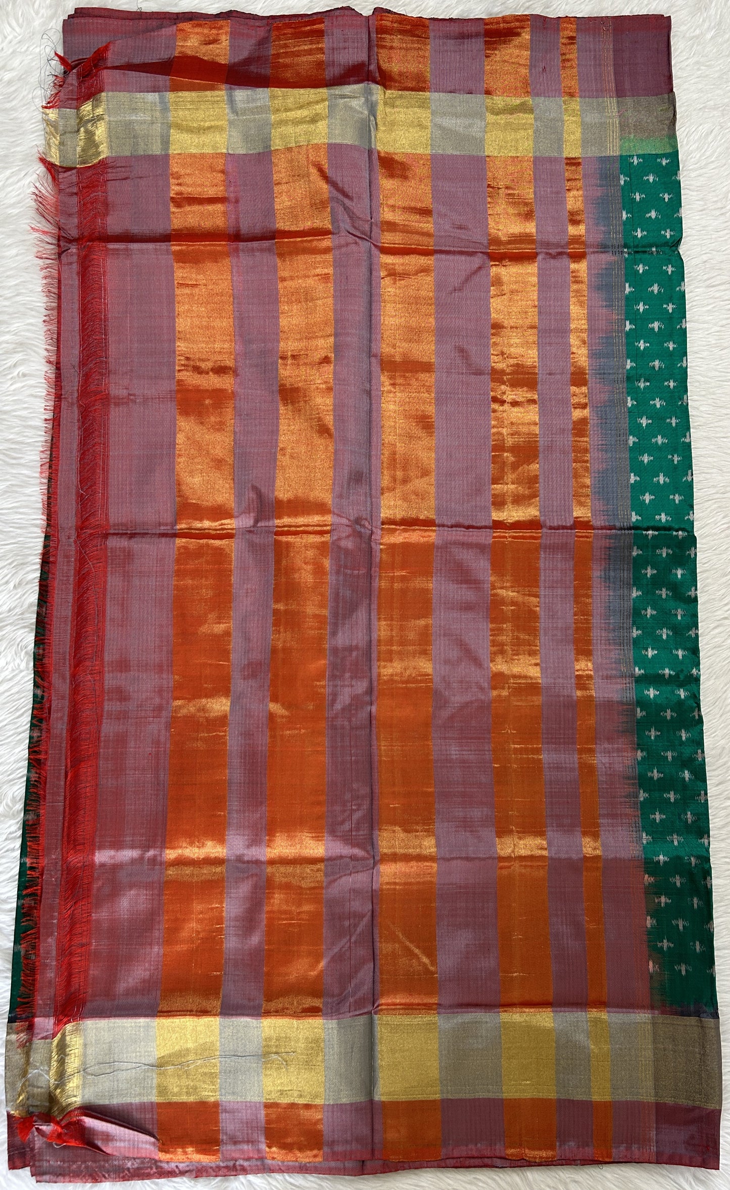 Ikkat Pattu Saree Bottle Green colored Saree complemented with a Onion Pink Colored Plain border. - Sampradaya Designer Studio