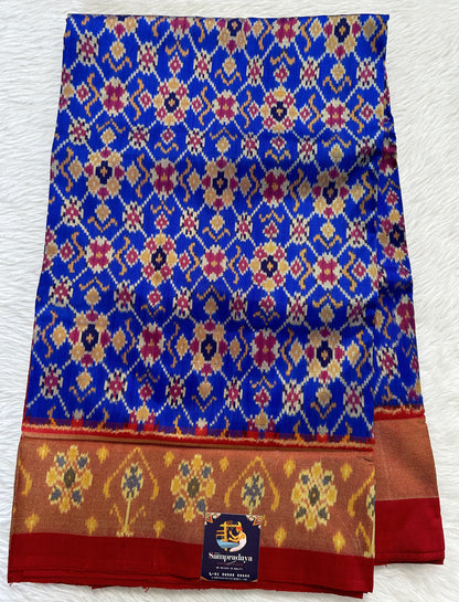 Ikkat Pattu Saree Blue colored Saree complemented with a Red Colored Ikkat border. - Sampradaya Designer Studio