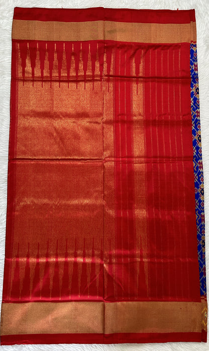 Ikkat Pattu Saree Blue colored Saree complemented with a Red Colored Ikkat border. - Sampradaya Designer Studio