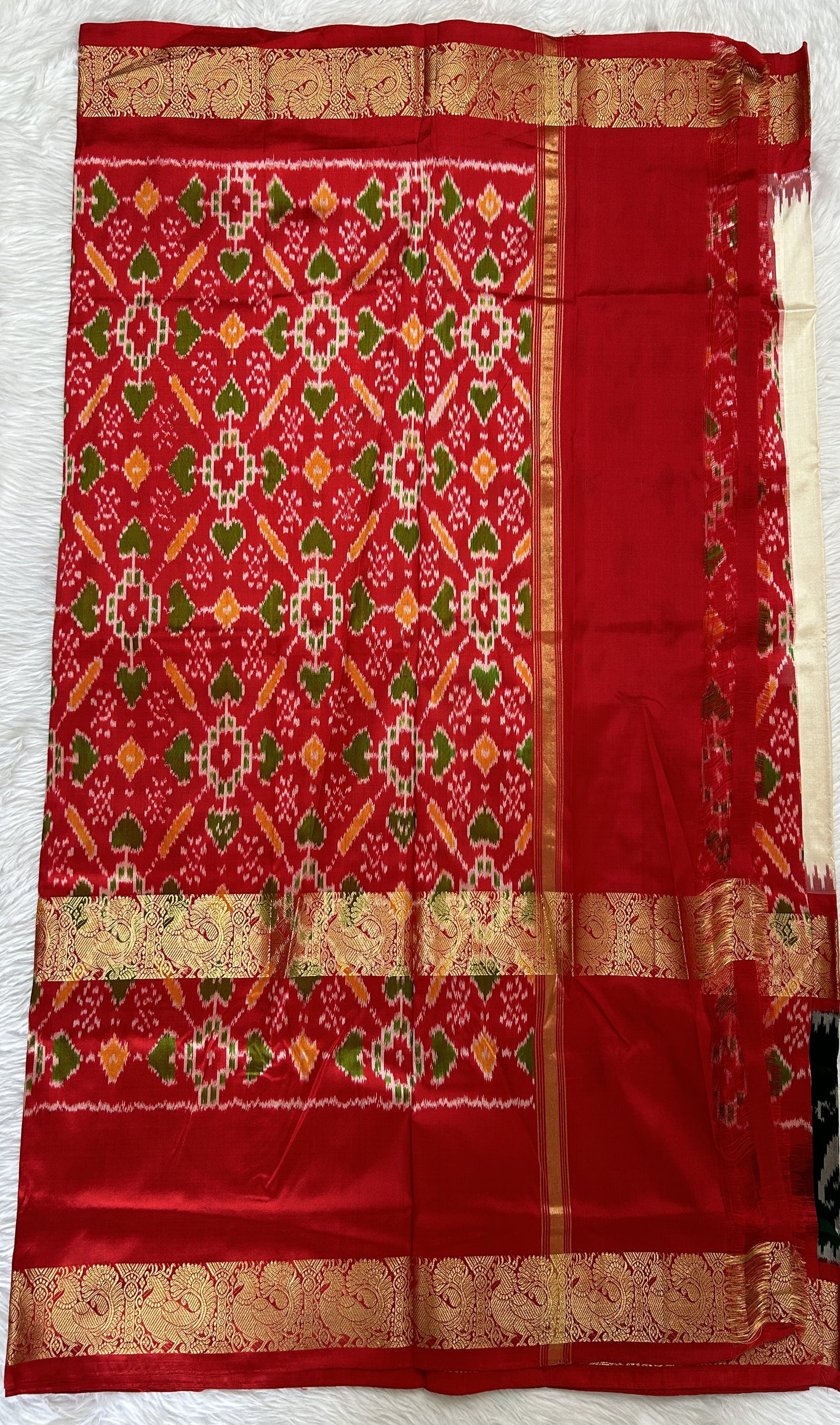 Ikkat Pattu Saree Off white colored Saree complemented with a Red Colored Ikkat Kanchi border. - Sampradaya Designer Studio