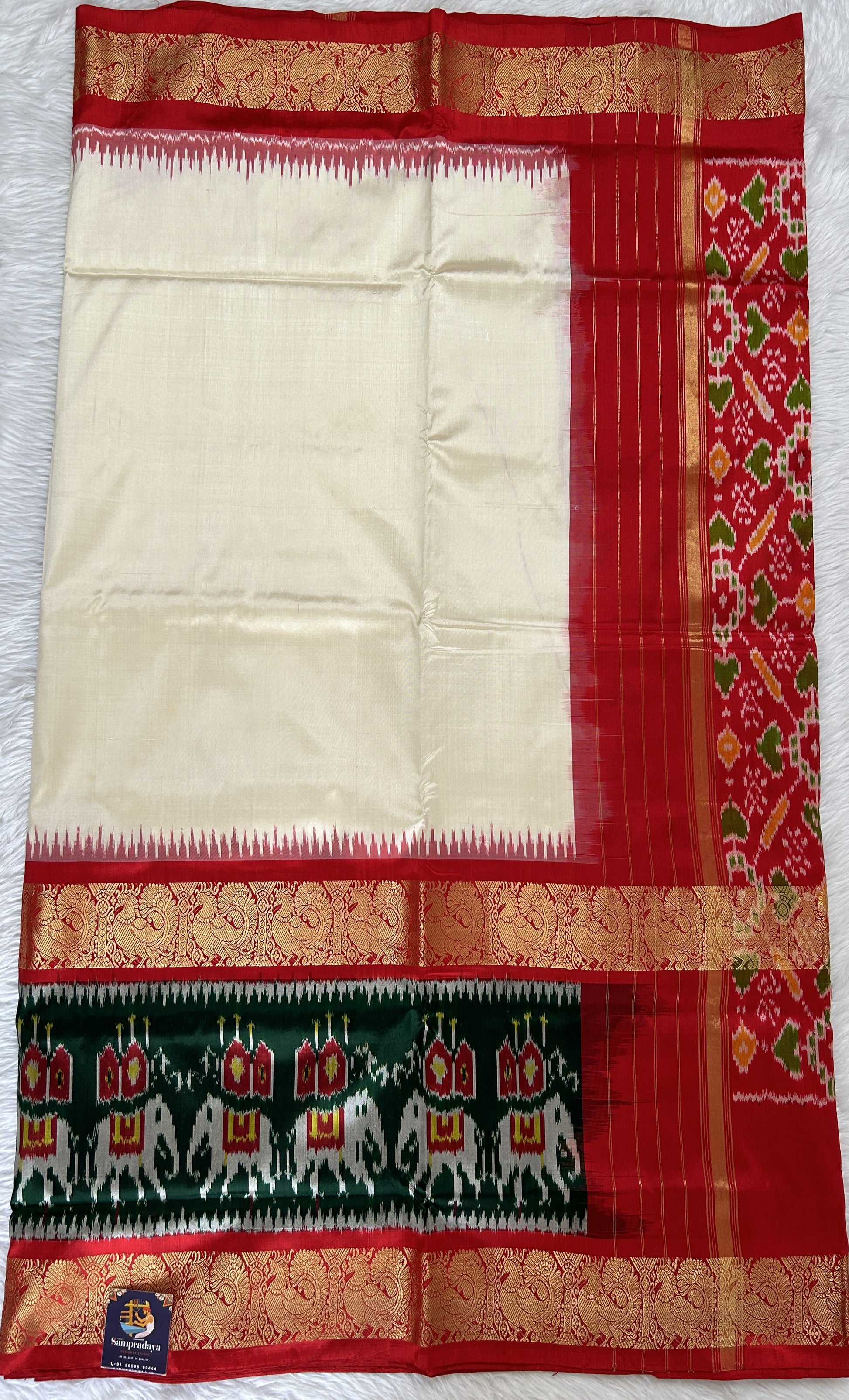 Ikkat Pattu Saree Off white colored Saree complemented with a Red Colored Ikkat Kanchi border. - Sampradaya Designer Studio