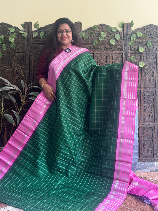 Gadwal Silk Saree Bottle Green Colored Complemented With a Pink Zari Border