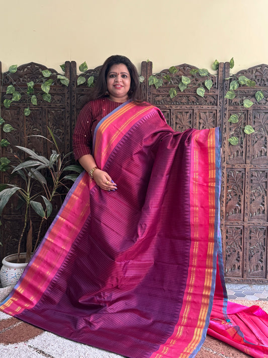 Gadwal Silk Saree Grape Colored Complemented With a Pink Zari Gap Border