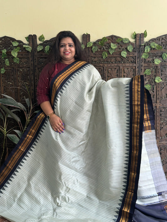 Gadwal Silk Saree Light Pista Green Colored Complemented With a Indigo Blue Zari Border