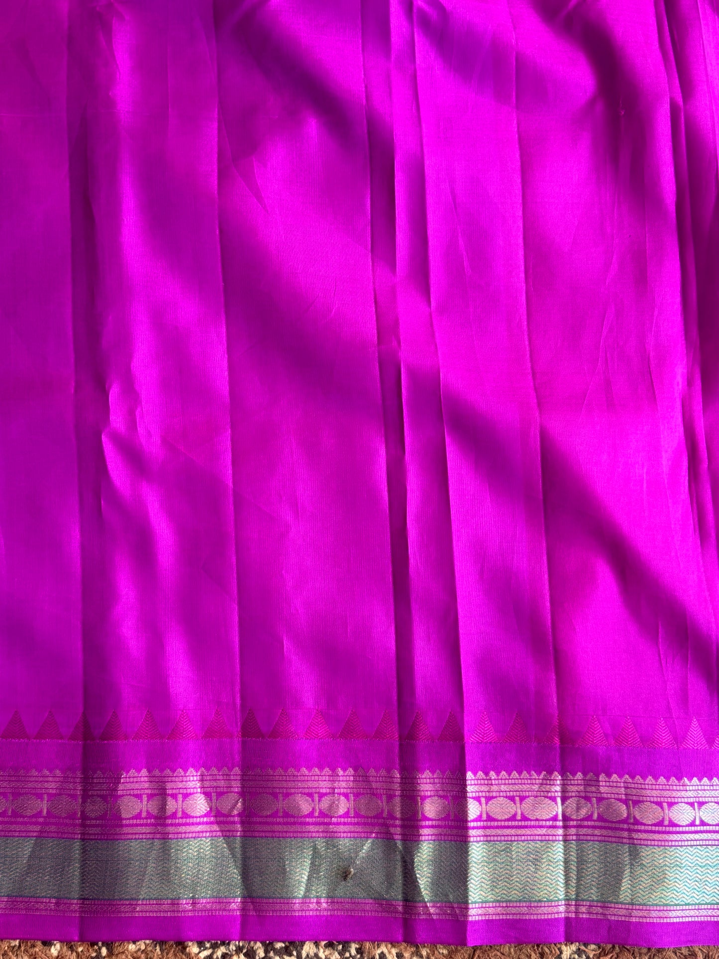 Gadwal Pattu Saree Peacock Blue colored saree complemented with a Purple Zari border