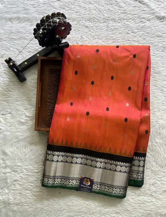 Gadwal Pattu Saree Orange Colored Complemented With a Zari Border - Sampradaya Designer Studio