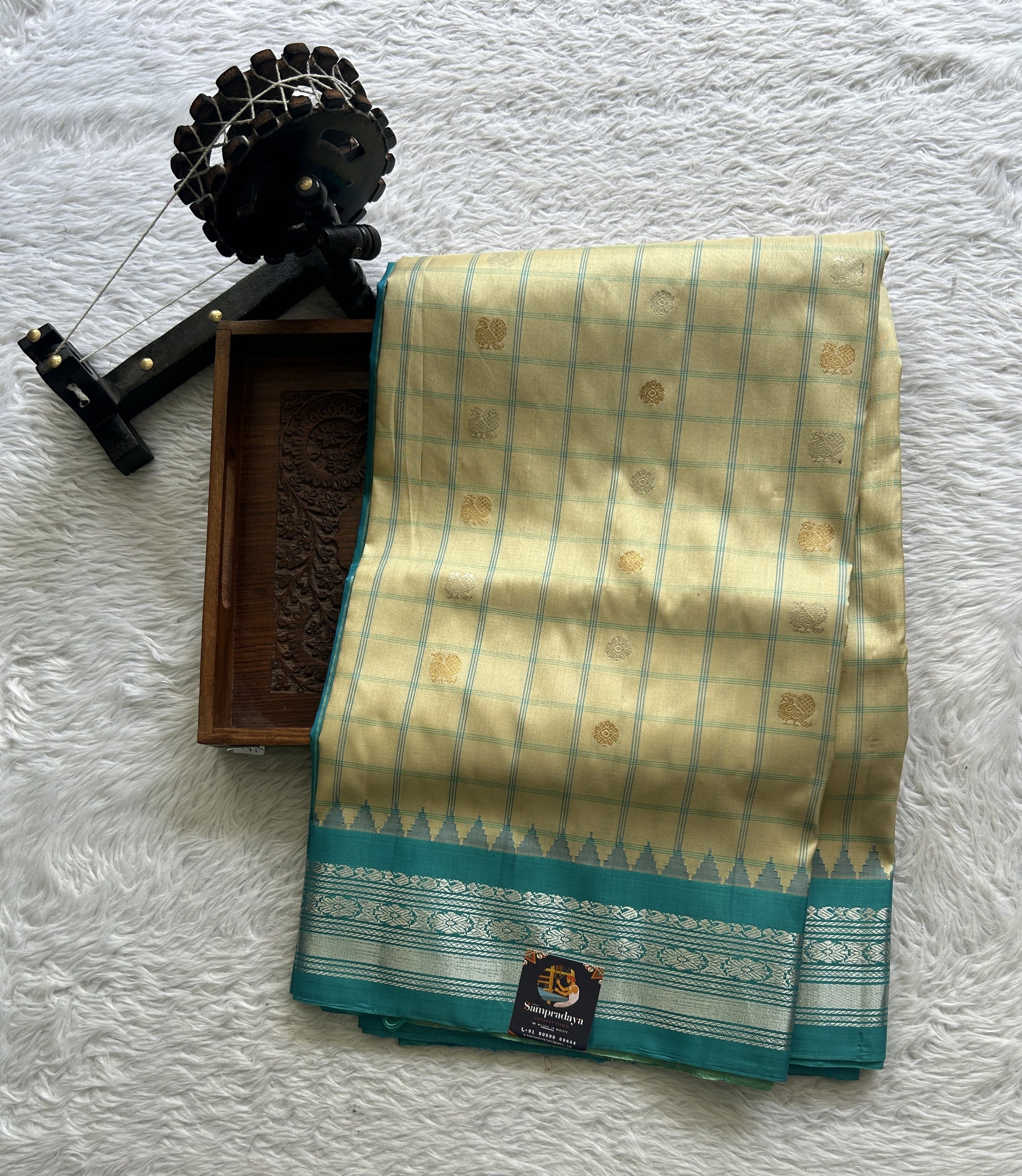 Gadwal Pattu Saree Cream Colored Complemented With a Zari Border - Sampradaya Designer Studio