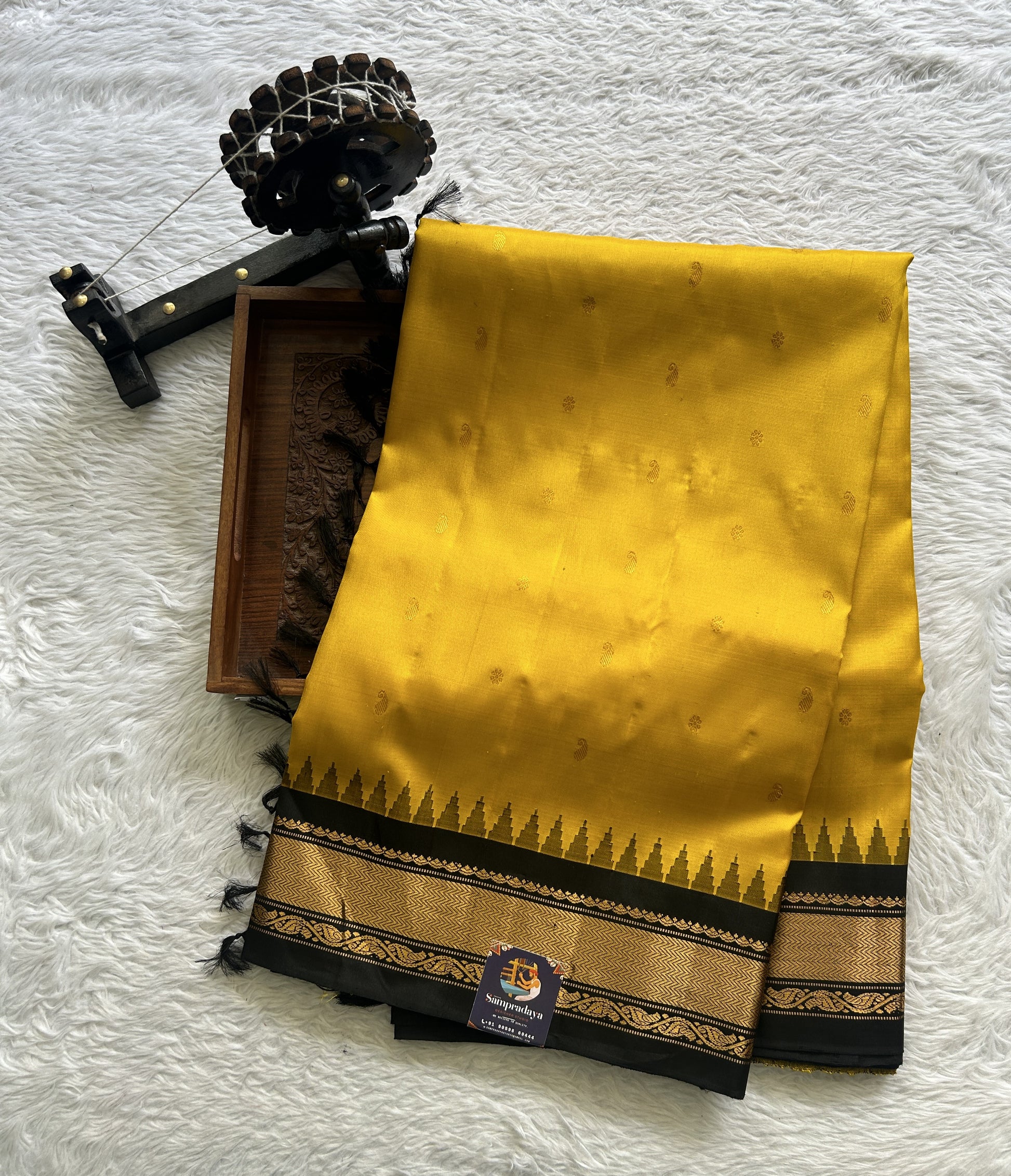 Gadwal Pattu Saree Turmeric Yellow Colored Complemented With a Zari Border - Sampradaya Designer Studio