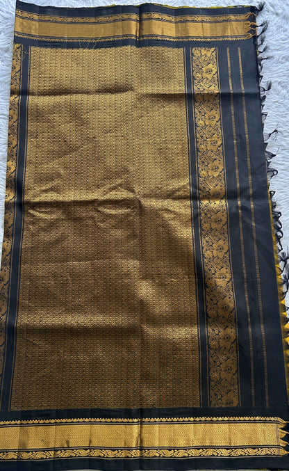 Gadwal Pattu Saree Turmeric Yellow Colored Complemented With a Zari Border - Sampradaya Designer Studio