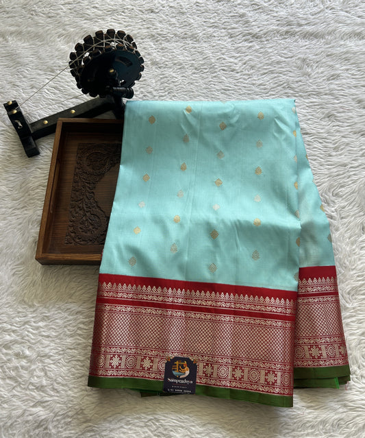 Gadwal Pattu Saree Sea Blue Colored Complemented With a Red Color Zari Border - Sampradaya Designer Studio