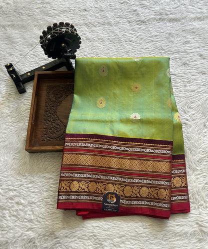 Gadwal Pattu Saree Green Colored Complemented With a Dark Pink Color Zari Border - Sampradaya Designer Studio