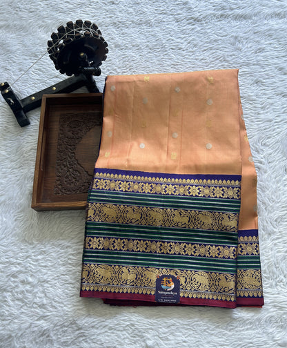 Gadwal Pattu Saree Light Orange Colored Complemented With a Ink Blue Color Zari Border - Sampradaya Designer Studio