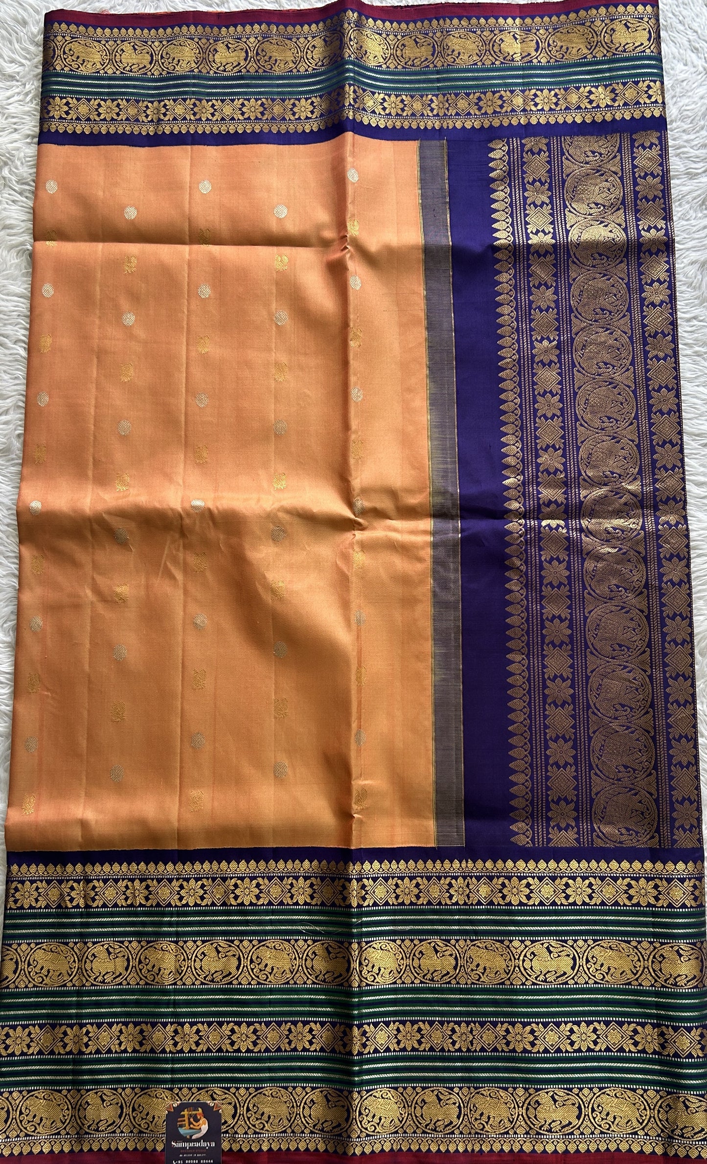 Gadwal Pattu Saree Light Orange Colored Complemented With a Ink Blue Color Zari Border - Sampradaya Designer Studio