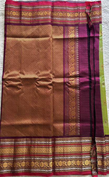 Gadwal Pattu Saree Green Colored Complemented With a Dark Pink Color Zari Border - Sampradaya Designer Studio