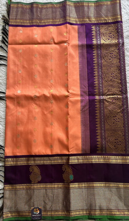 Gadwal Pattu Saree Peach Colored Complemented With a Purple Color Zari Border - Sampradaya Designer Studio