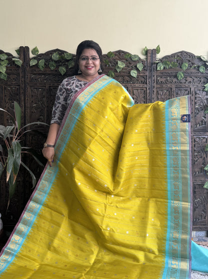 Gadwal Silk Saree Yellow Colored Complemented With a Kanchi Border