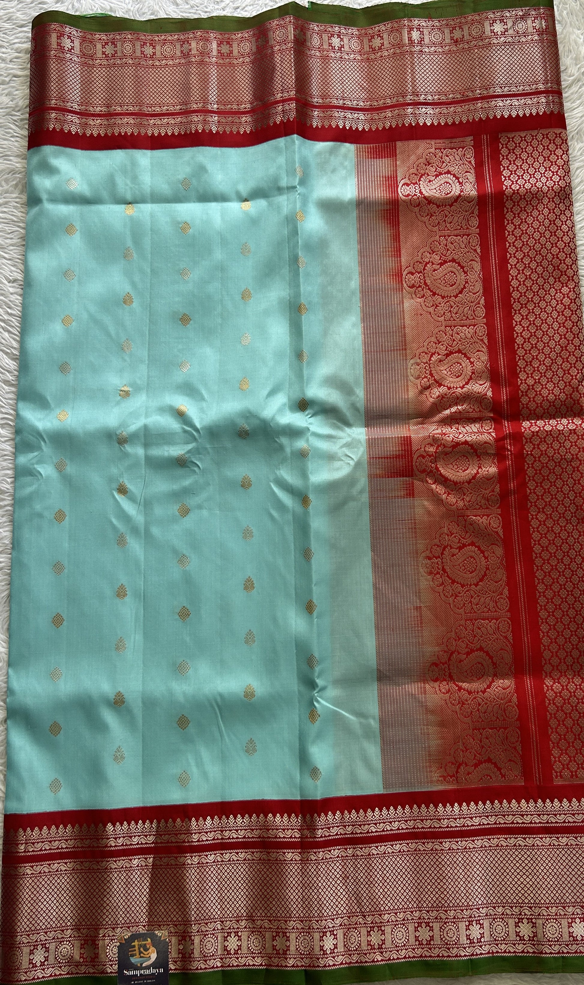 Gadwal Pattu Saree Sea Blue Colored Complemented With a Red Color Zari Border - Sampradaya Designer Studio