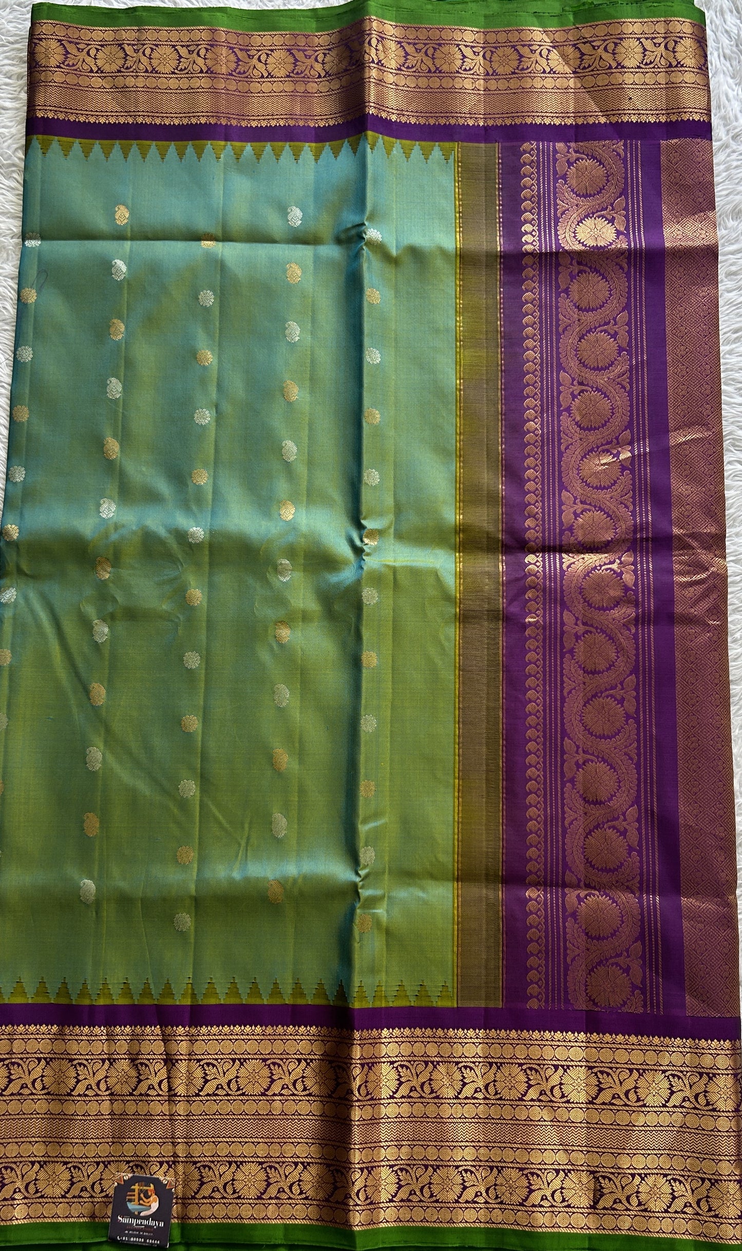 Gadwal Pattu Saree Rama Green Colored Complemented With a Violet Color Zari Border - Sampradaya Designer Studio