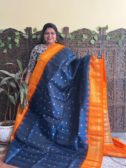 Gadwal Silk Saree Teal Blue Colored Complemented With a Orange Zari Border