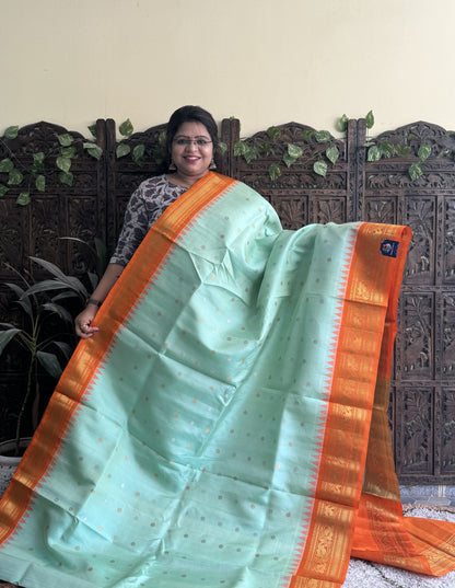 Gadwal Silk Saree Sea Green Colored Complemented With a Orange Zari Border