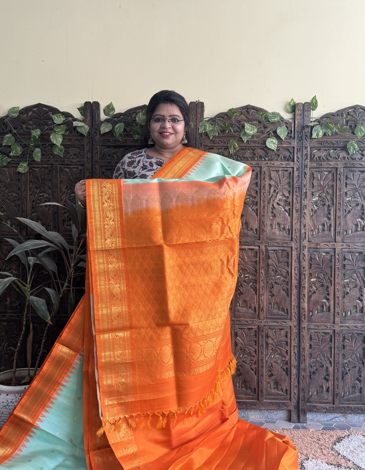 Gadwal Silk Saree Sea Green Colored Complemented With a Orange Zari Border