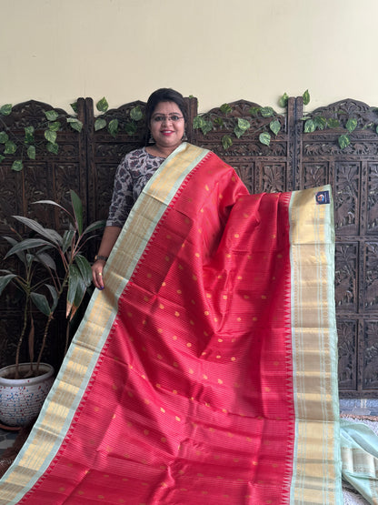 Gadwal Silk Saree Red Colored Complemented With a Sea Green Zari Border