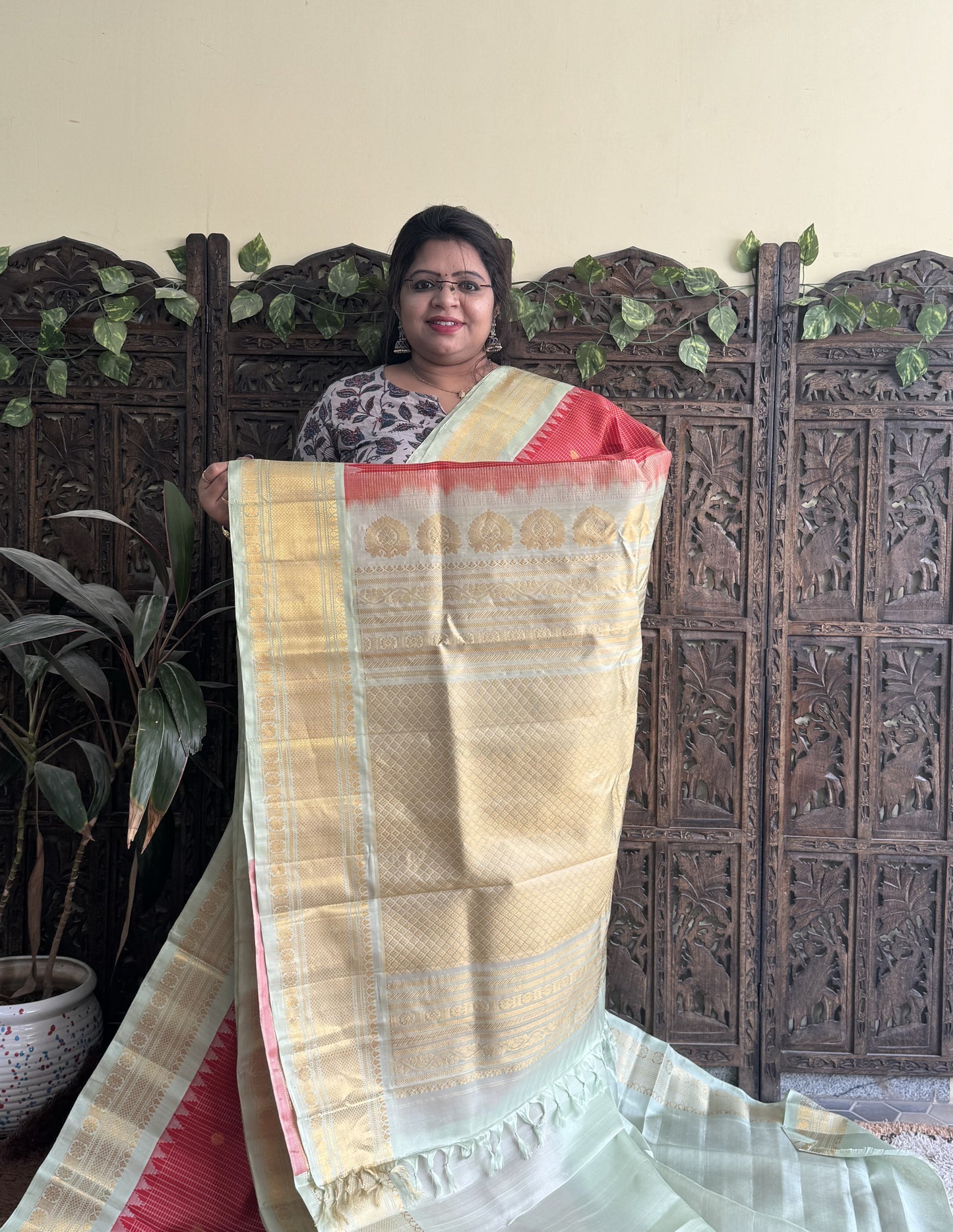 Gadwal Silk Saree Red Colored Complemented With a Sea Green Zari Border