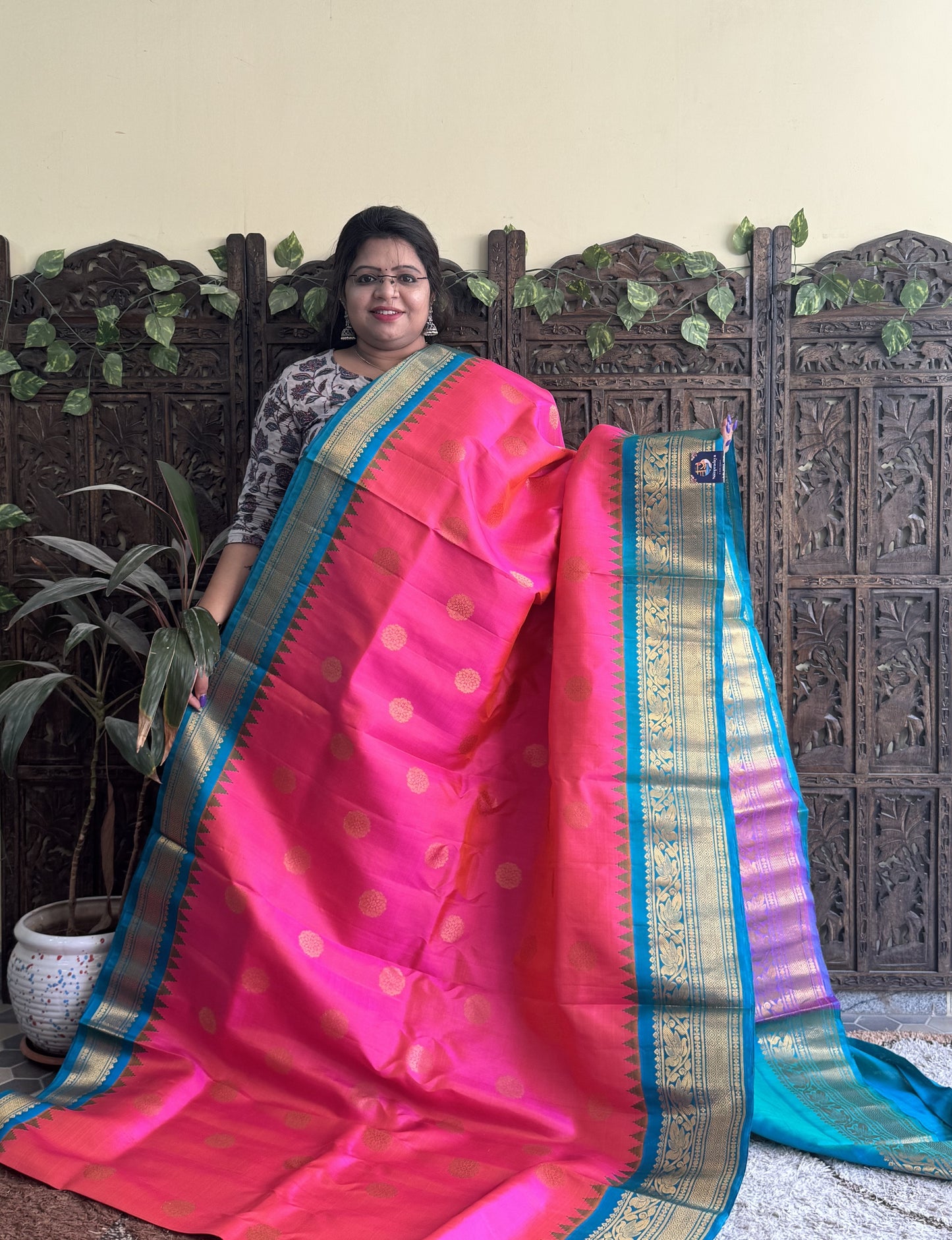 Gadwal Silk Saree Pink Colored Complemented With a Turquoise Blue Zari Border