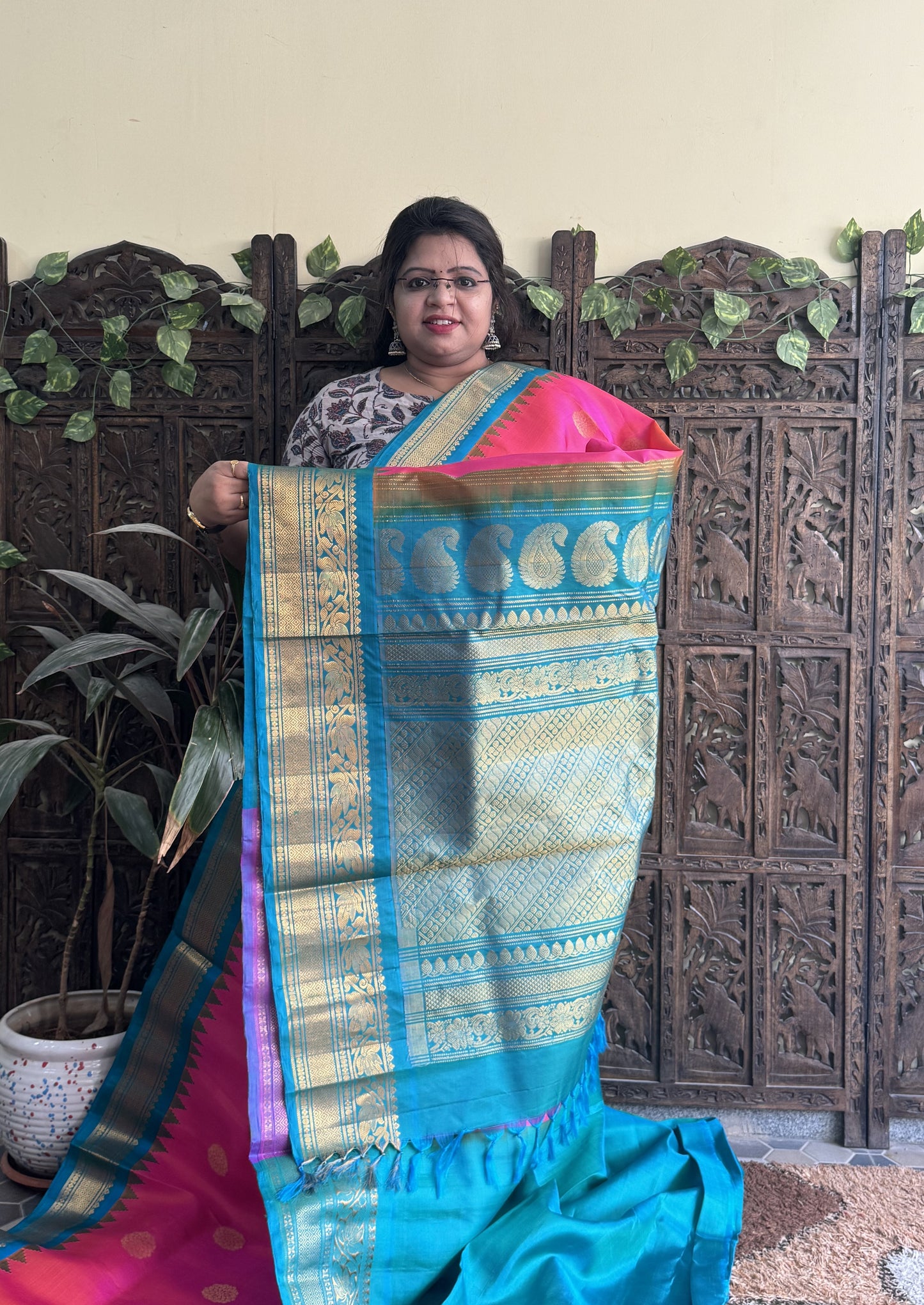 Gadwal Silk Saree Pink Colored Complemented With a Turquoise Blue Zari Border